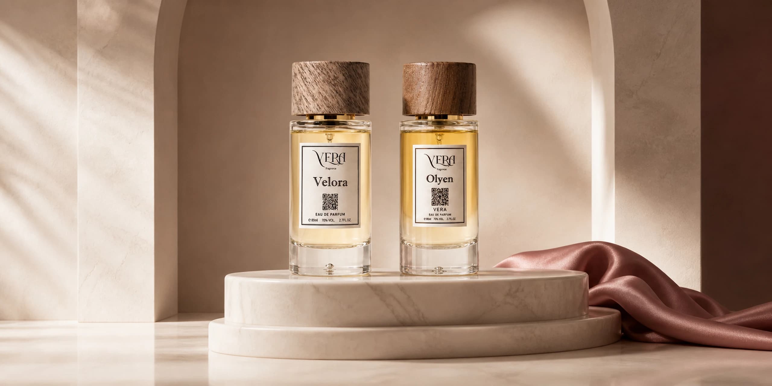 VERA Velora and Olyen Eau de Parfum bottles on an ivory plinth